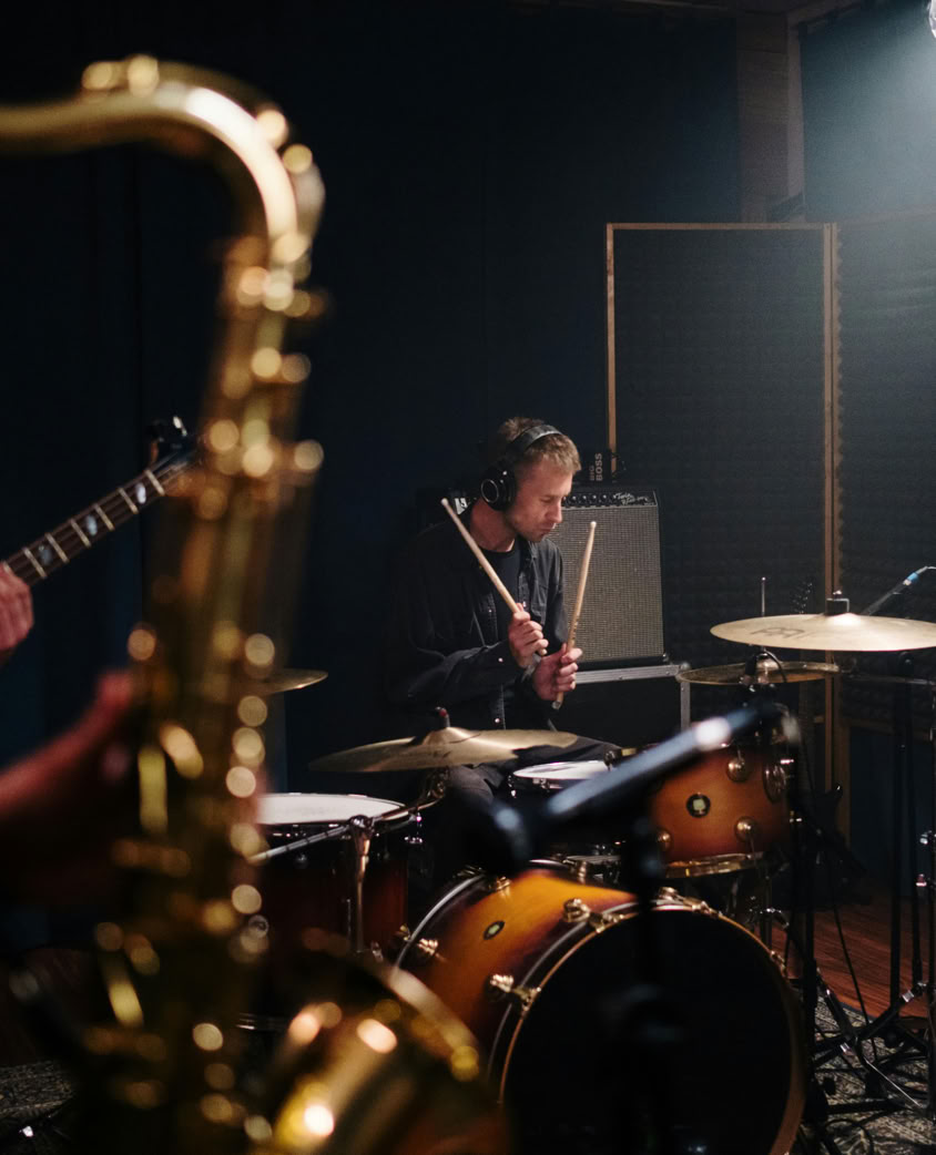 Man Playing Drums Inside the Sound Studio